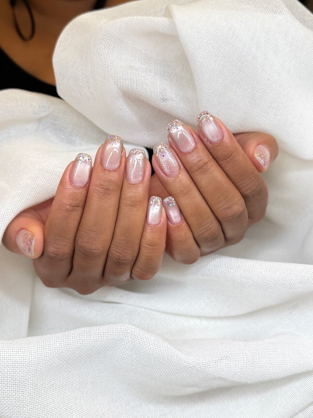 Glitter ombre gel nails in soft pink