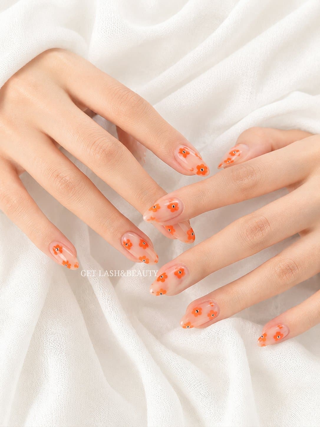 Sheer nails with hand painted orange flower nail art